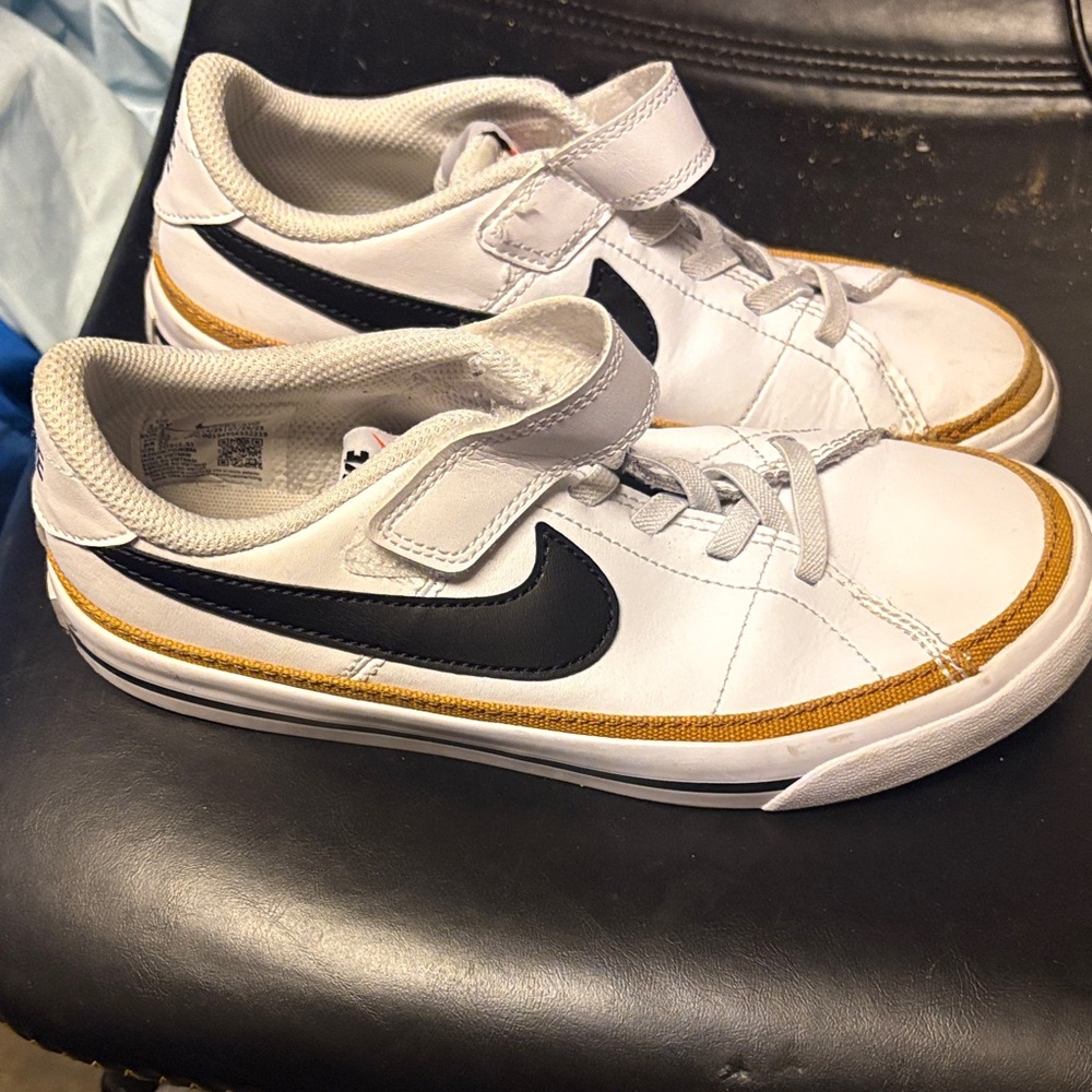 Nike White Sneakers with Black and Gold Details
